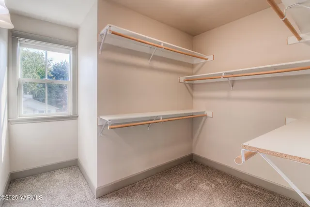 a view of an empty walk in closet