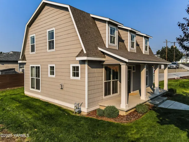 a front view of a house with a yard