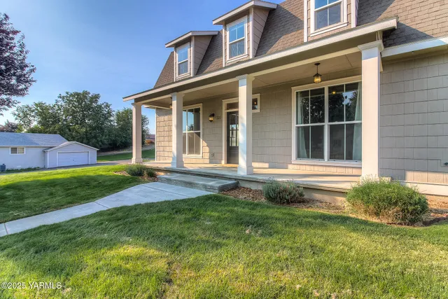 front view of a house with a yard