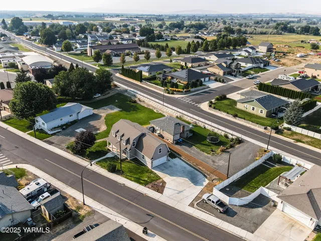 an aerial view of a pool yard and mountain view
