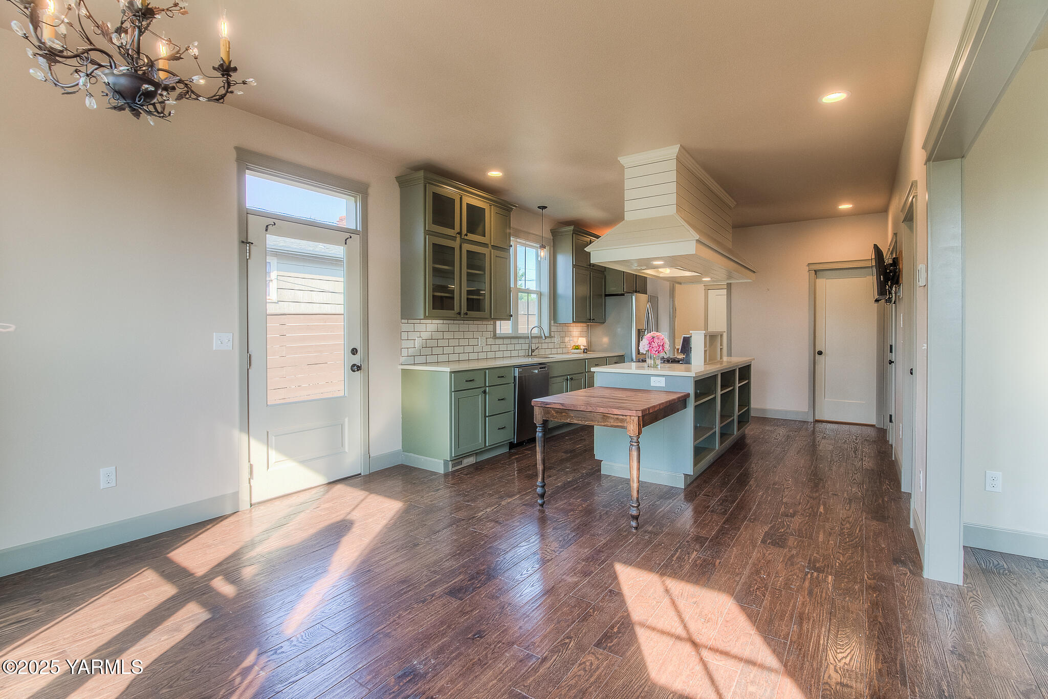 221 4th Avenue Zillah, WA 98953 - Photo 8 of 32 a room with stainless steel appliances kitchen island granite countertop furniture and a wooden floor