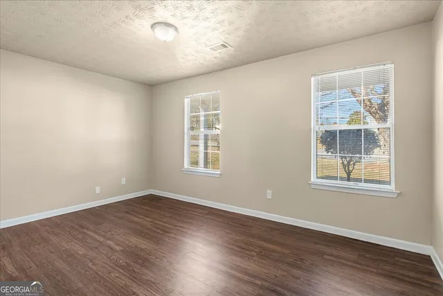 a bathroom with a sink a toilet and shower curtain