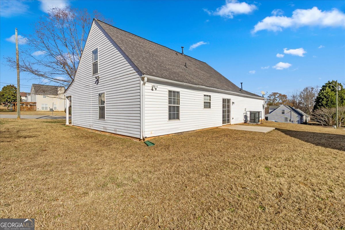 2603 Old Rex Morrow Road Ellenwood, GA 30294 - Photo 28 of 32 a view of a house with a backyard