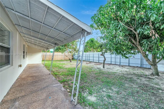 a view of a backyard with tree s