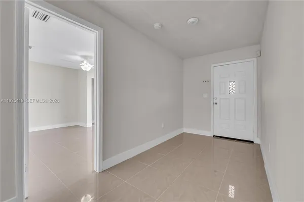 an empty room with closet area