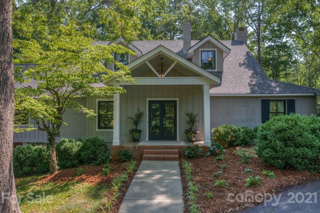 202 Blockhouse Road Landrum, SC 29356 - Photo 2 of 45 a front view of a house with yard and green space