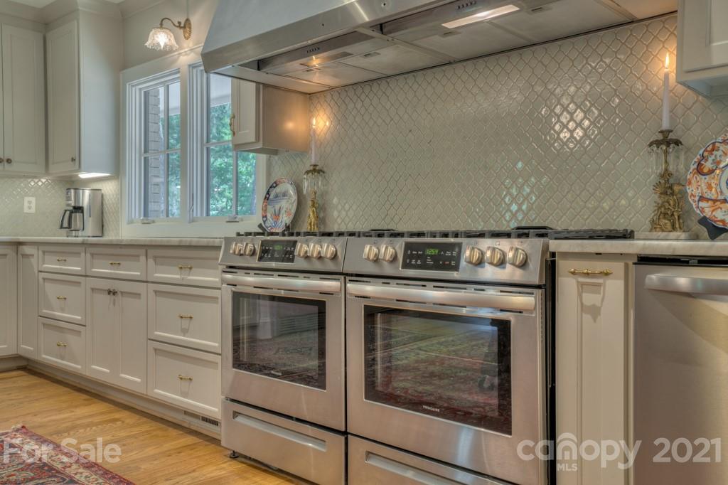202 Blockhouse Road Landrum, SC 29356 - Photo 15 of 45 a stove top oven sitting inside of a kitchen