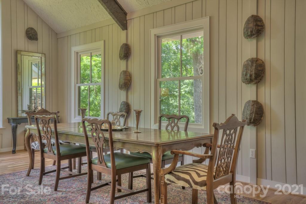 202 Blockhouse Road Landrum, SC 29356 - Photo 20 of 45 a view of a dining room with furniture and chandelier