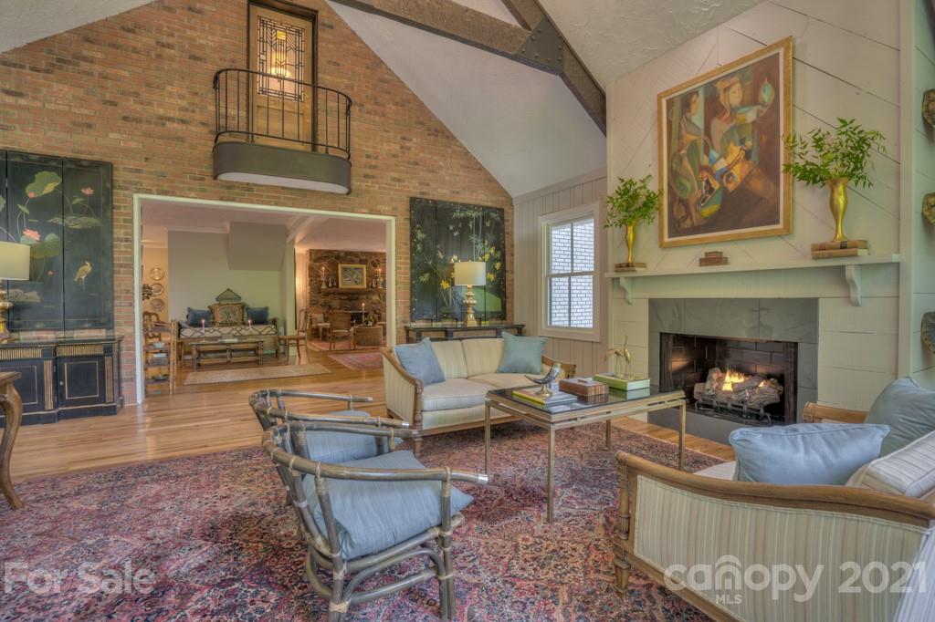 202 Blockhouse Road Landrum, SC 29356 - Photo 23 of 45 a living room with furniture and a fireplace