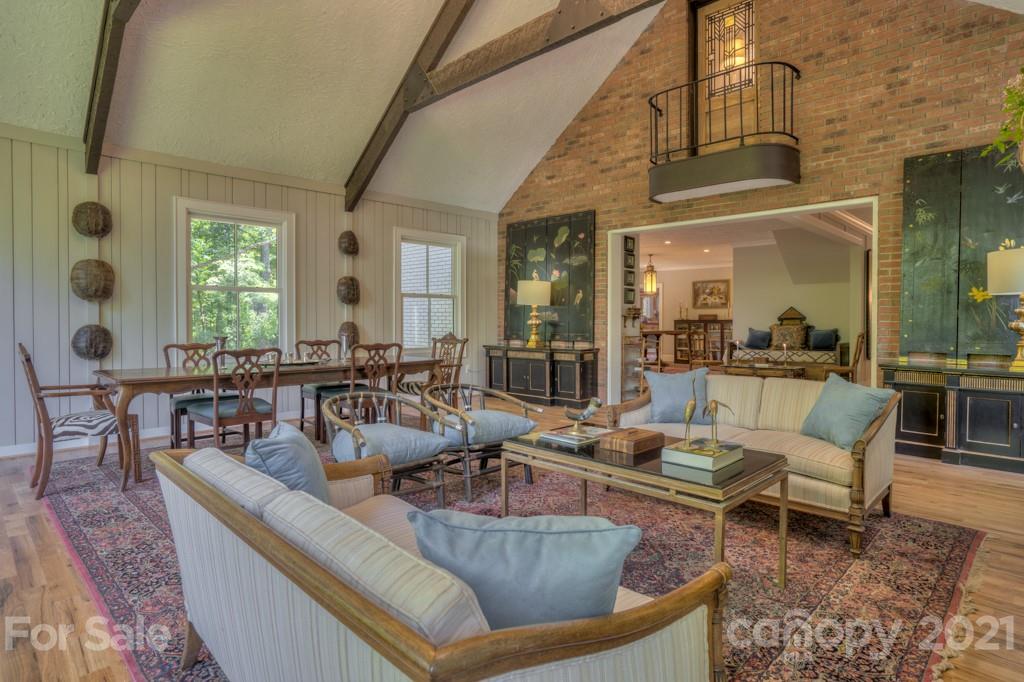 202 Blockhouse Road Landrum, SC 29356 - Photo 24 of 45 a living room with couches chairs and a large mirror with wooden floor