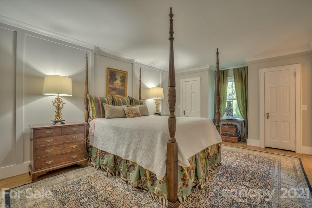 202 Blockhouse Road Landrum, SC 29356 - Photo 32 of 45 a bed room with a bed and a mirror