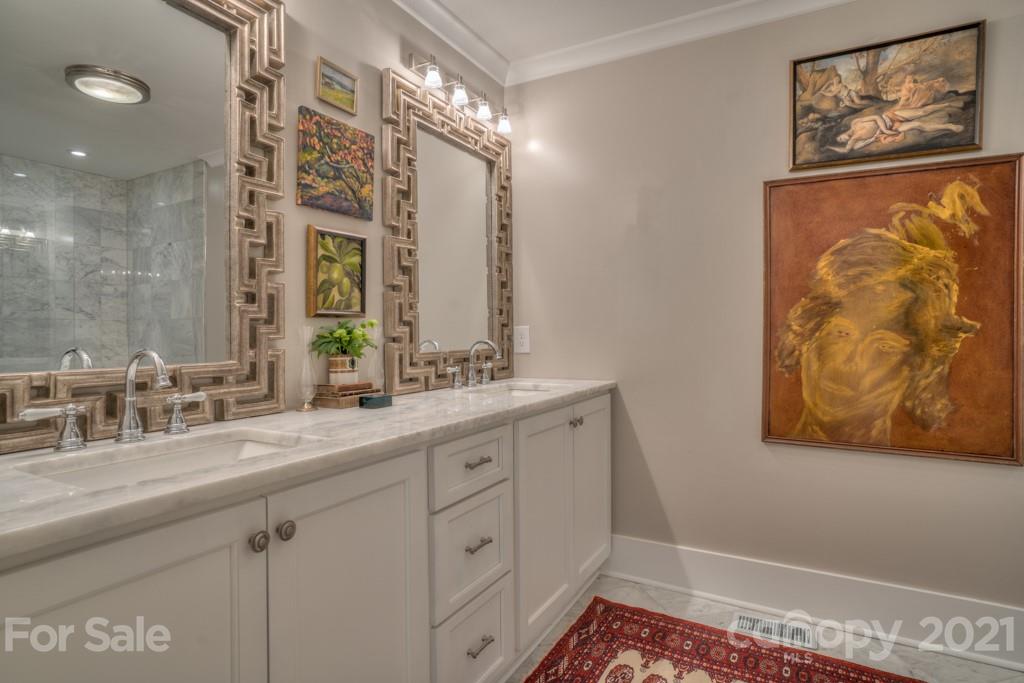 202 Blockhouse Road Landrum, SC 29356 - Photo 35 of 45 a bathroom with a double vanity sink and a mirror