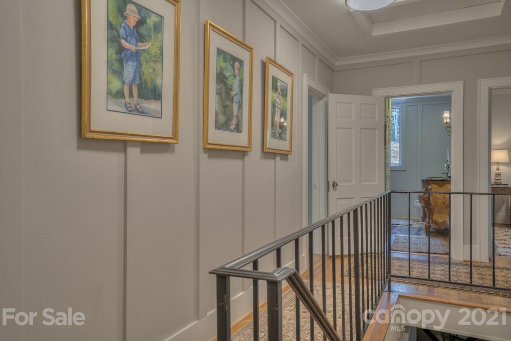 202 Blockhouse Road Landrum, SC 29356 - Photo 38 of 45 a view of staircase with lots of frames on wall and a window
