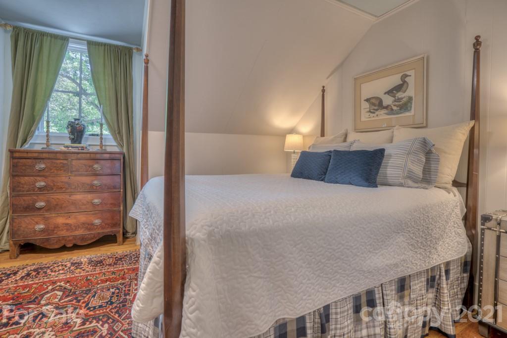 202 Blockhouse Road Landrum, SC 29356 - Photo 39 of 45 a bedroom with a large bed and a window