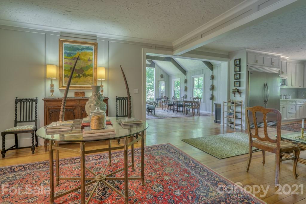 202 Blockhouse Road Landrum, SC 29356 - Photo 5 of 45 a living room with dining table and a wooden floor