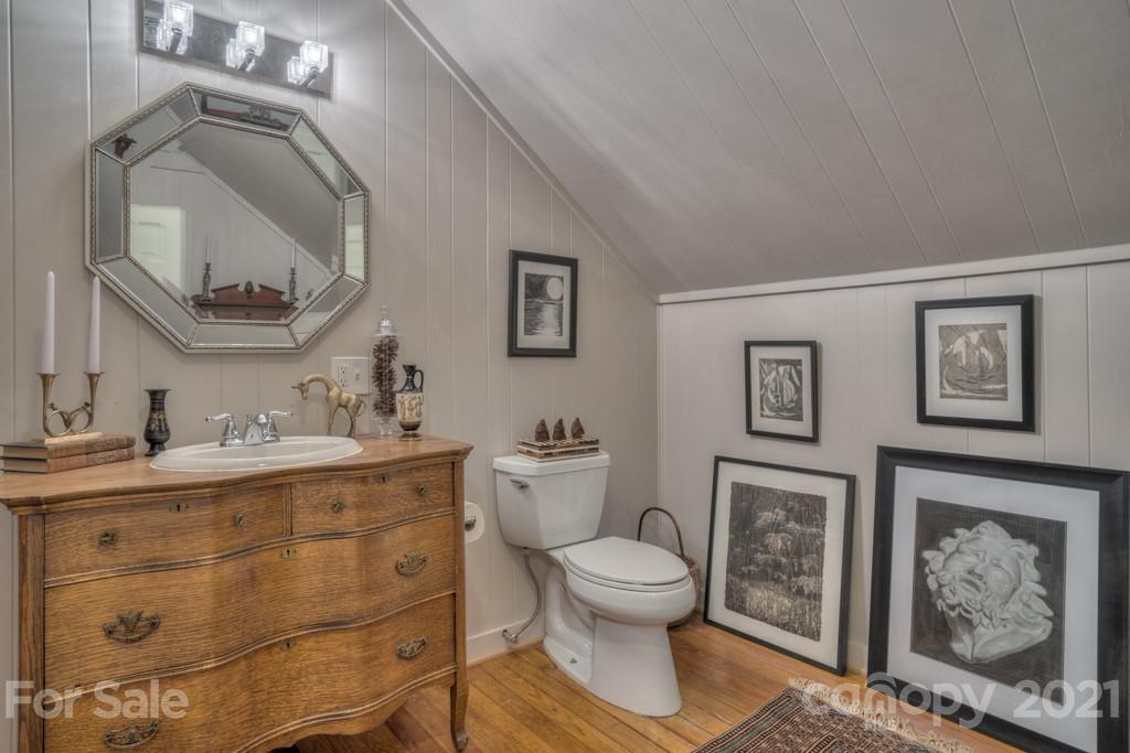 202 Blockhouse Road Landrum, SC 29356 - Photo 42 of 45 a spacious bathroom with a toilet sink and mirror