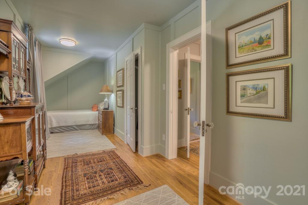 202 Blockhouse Road Landrum, SC 29356 - Photo 43 of 45 a view of a hallway with wooden floor and a bathroom