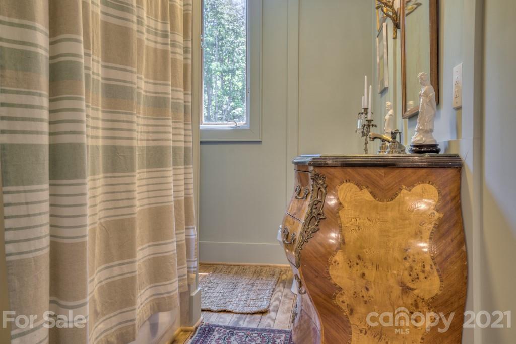 202 Blockhouse Road Landrum, SC 29356 - Photo 44 of 45 a bathroom with a granite countertop shower and a sink