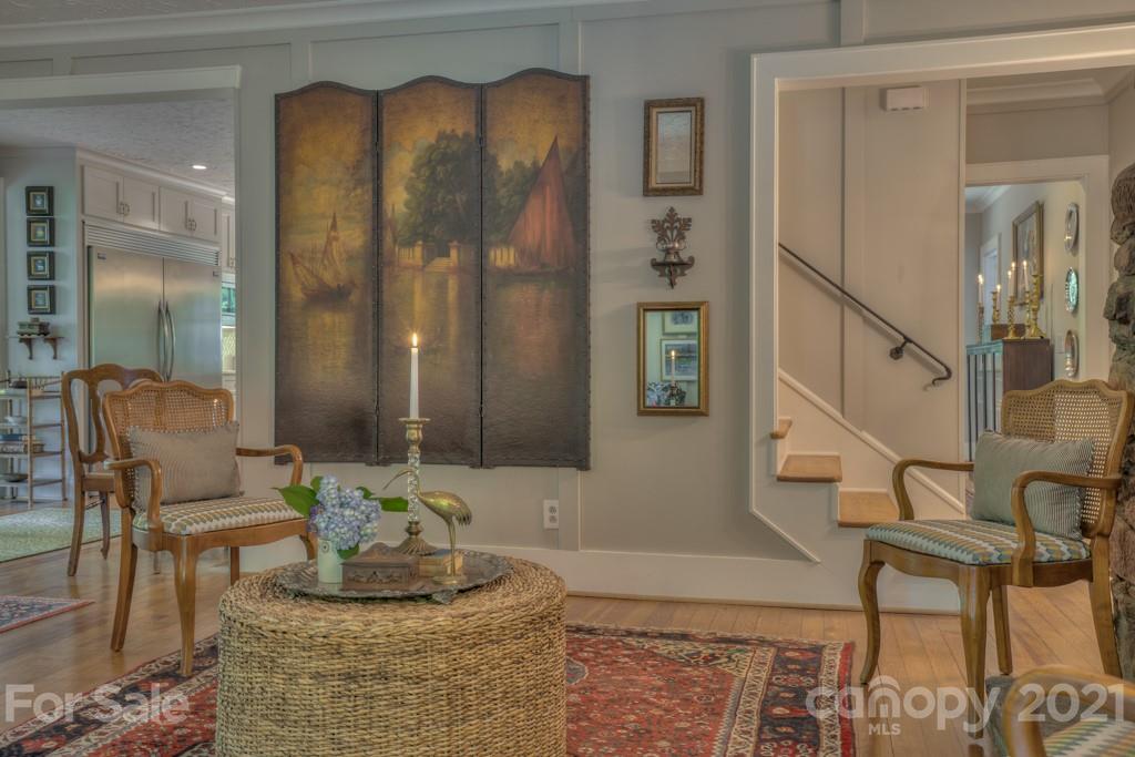 202 Blockhouse Road Landrum, SC 29356 - Photo 6 of 45 a living room with couches chairs and closet with wooden floor