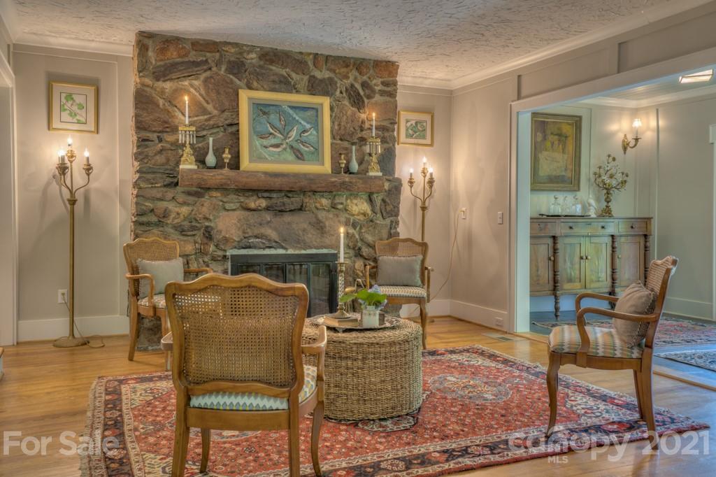202 Blockhouse Road Landrum, SC 29356 - Photo 8 of 45 a living room with furniture and a fireplace
