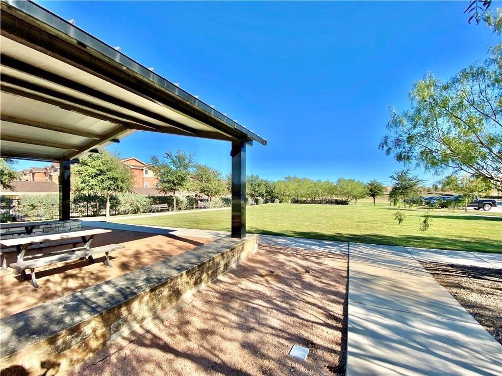 407 Rhetoric Way Pflugerville, TX 78660 - Photo 37 of 38 a view of swimming pool with a yard