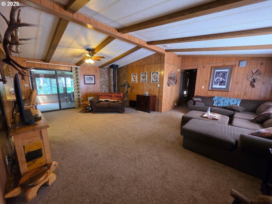 358 Oak Park Place Wamic, OR 97063 - Photo 13 of 29 a living room with furniture and a flat screen tv