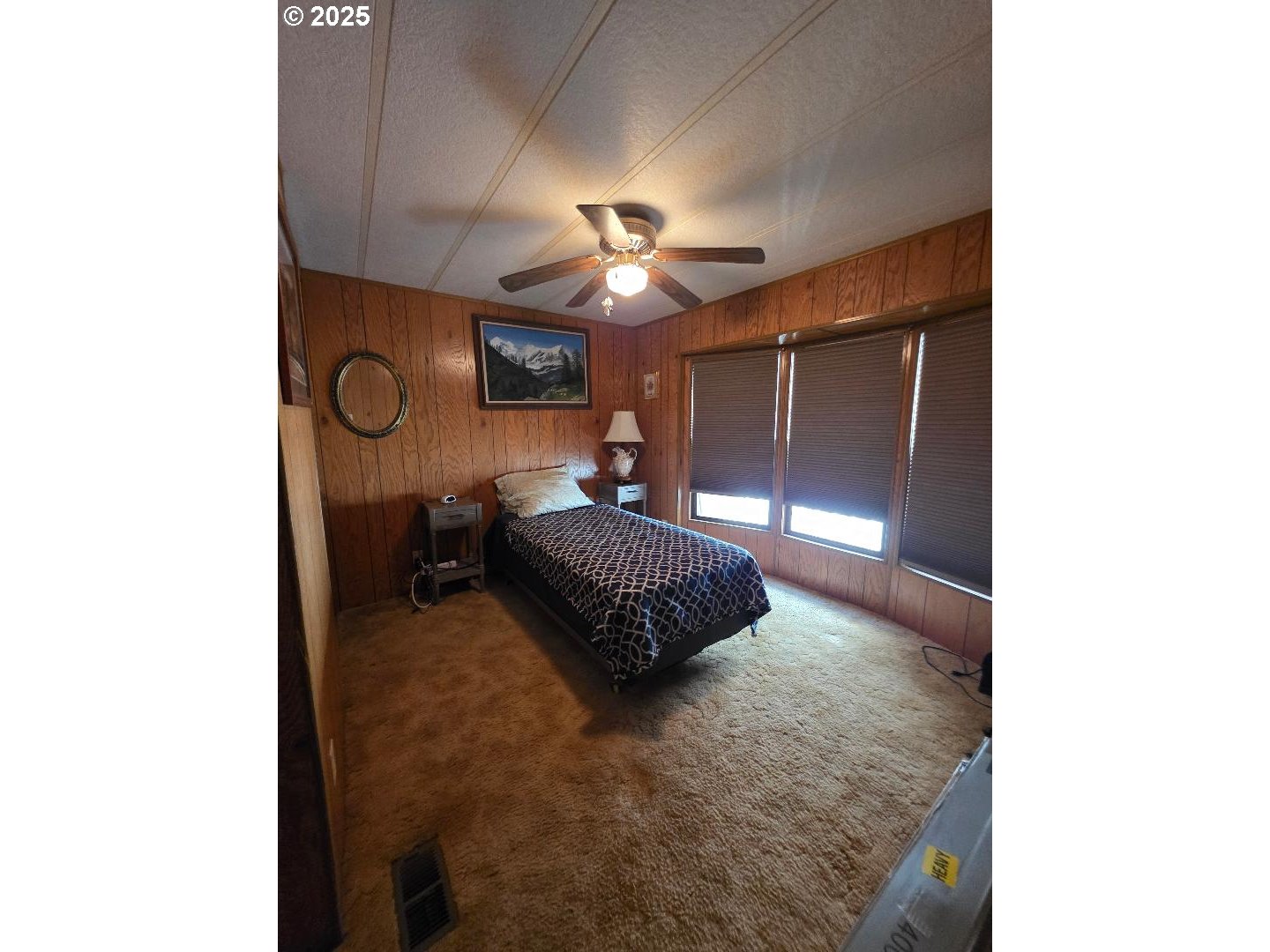 358 Oak Park Place Wamic, OR 97063 - Photo 17 of 29 a bedroom with a bed and a ceiling fan