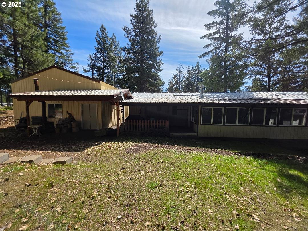 358 Oak Park Place Wamic, OR 97063 - Photo 3 of 29 a front view of a house with garden