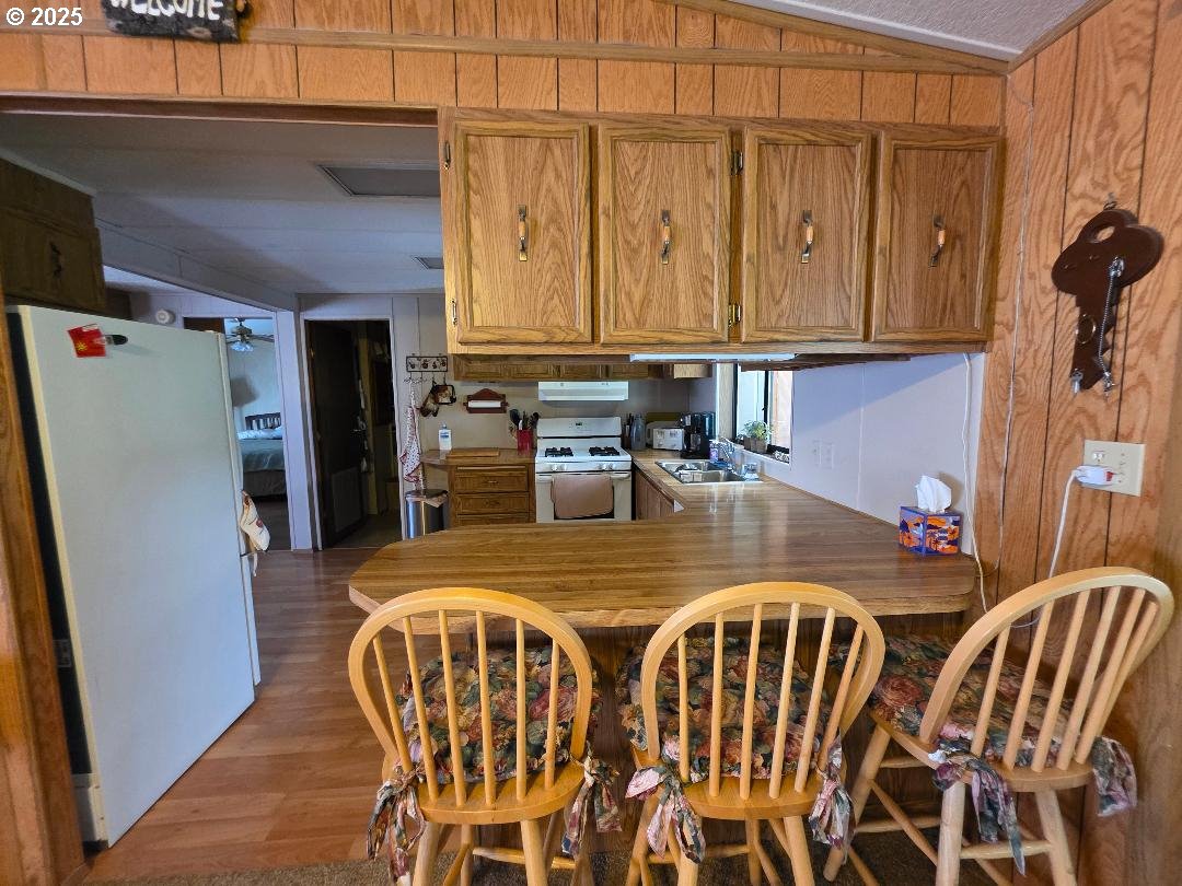 358 Oak Park Place Wamic, OR 97063 - Photo 5 of 29 a kitchen with a refrigerator and a table