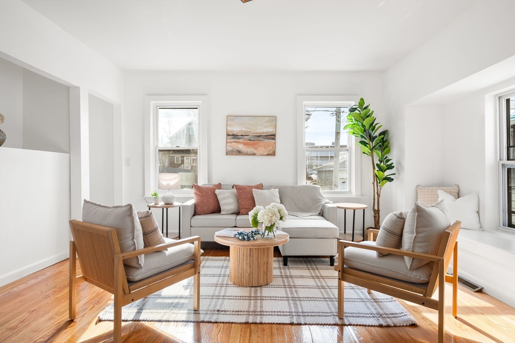 19 Berkley Road Hull, MA 02045 - Photo 11 of 42 a living room with furniture and a potted plant