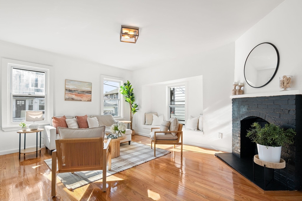 19 Berkley Road Hull, MA 02045 - Photo 12 of 42 a living room with furniture and a fireplace