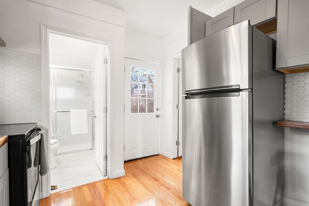 19 Berkley Road Hull, MA 02045 - Photo 20 of 42 a view of a kitchen with a refrigerator and a stove top oven