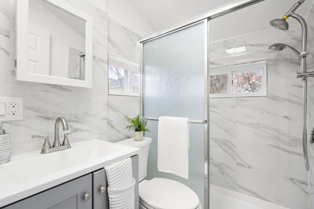 19 Berkley Road Hull, MA 02045 - Photo 21 of 42 a bathroom with a sink toilet and shower