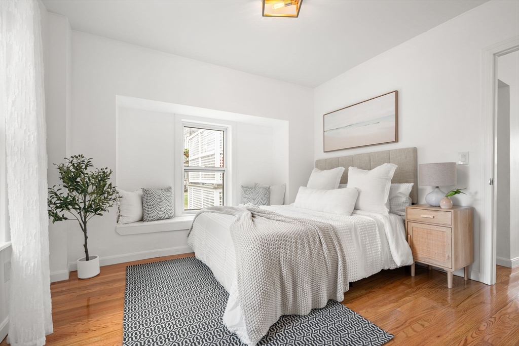 19 Berkley Road Hull, MA 02045 - Photo 22 of 42 a bedroom with a bed and a potted plant