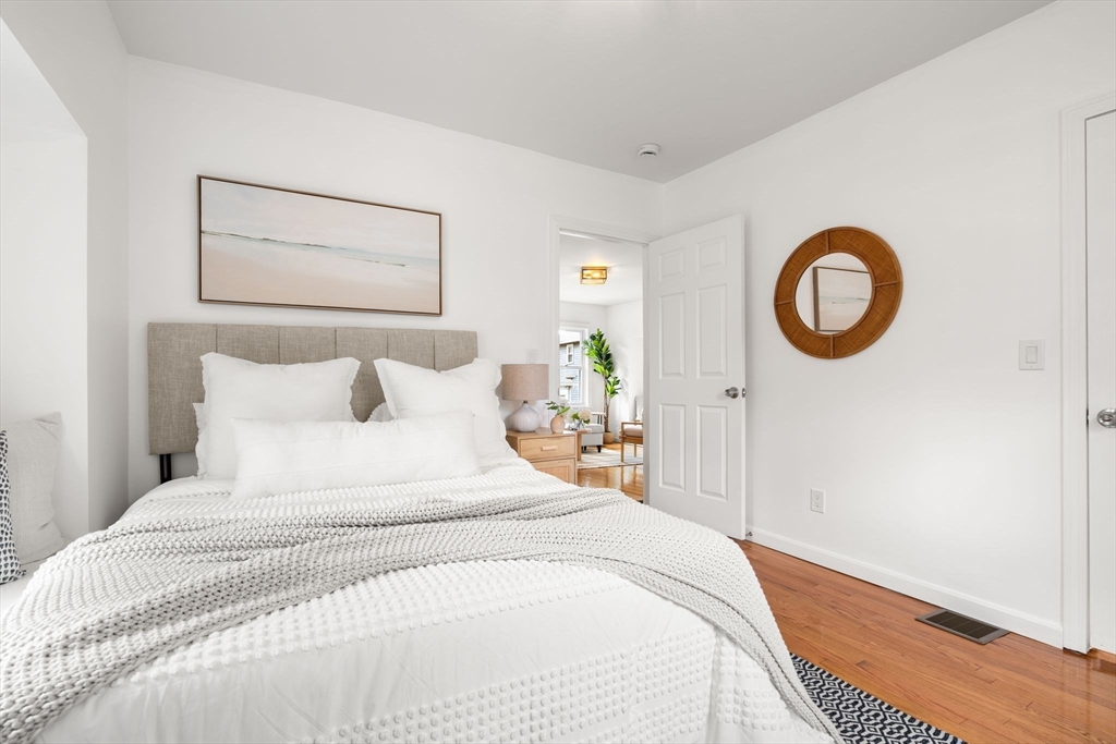 19 Berkley Road Hull, MA 02045 - Photo 24 of 42 a bedroom with a bed and a painting on the wall