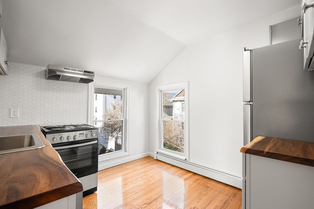 19 Berkley Road Hull, MA 02045 - Photo 27 of 42 a kitchen with a stove and a refrigerator