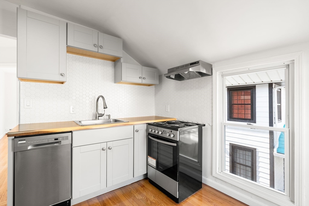 19 Berkley Road Hull, MA 02045 - Photo 28 of 42 a kitchen with cabinets appliances and a sink