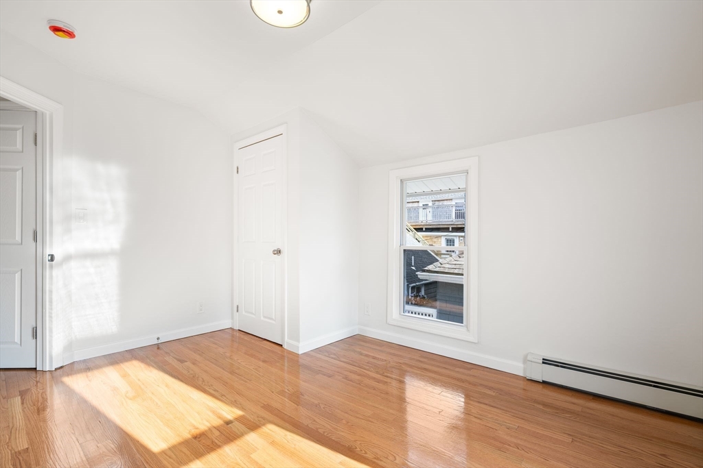 19 Berkley Road Hull, MA 02045 - Photo 36 of 42 a view of empty room with wooden floor and fan