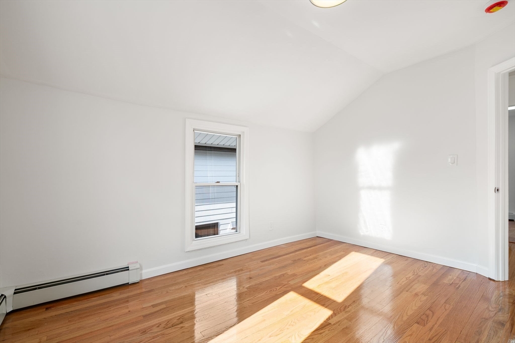 19 Berkley Road Hull, MA 02045 - Photo 38 of 42 an empty room with wooden floor and windows