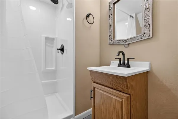 a bathroom with a sink and mirror