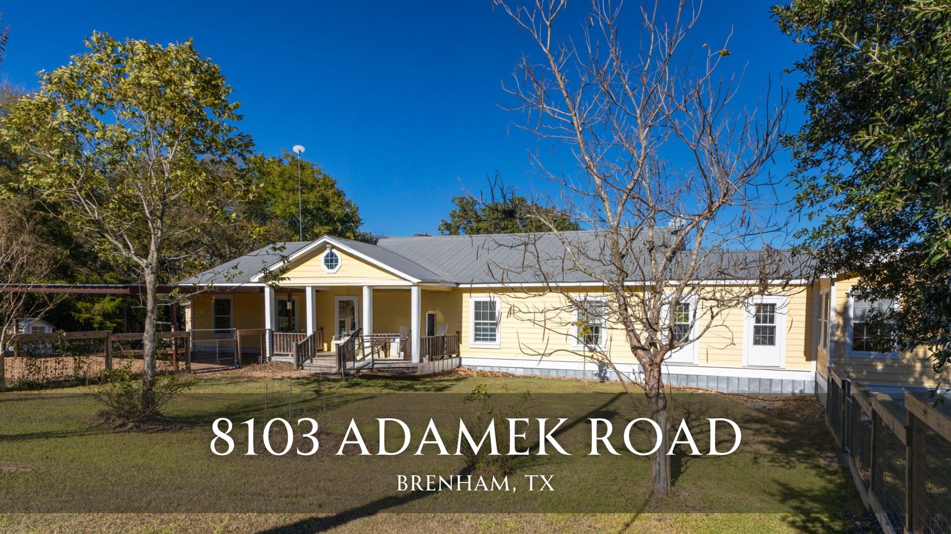8103 Adamek Road Brenham, TX 77833 - Photo 1 of 42 a front view of a building with street sign