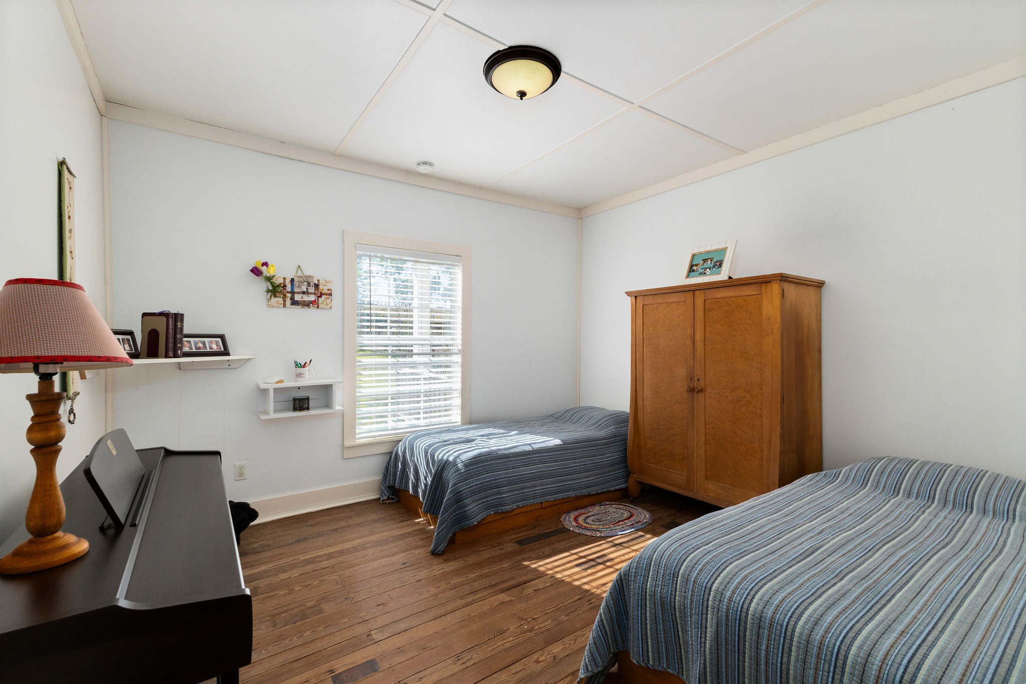 8103 Adamek Road Brenham, TX 77833 - Photo 11 of 42 a bedroom with a bed and a window