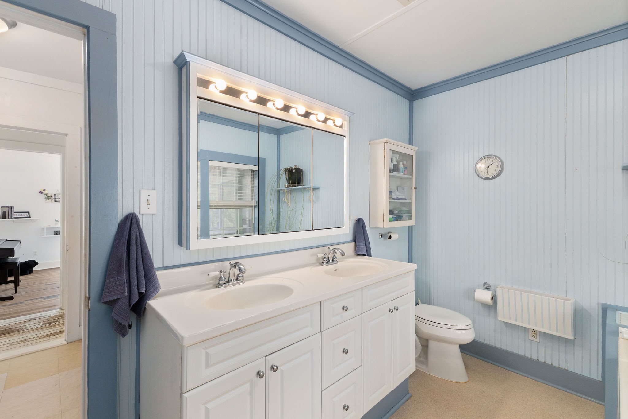 8103 Adamek Road Brenham, TX 77833 - Photo 13 of 42 a bathroom with a toilet sink and mirror