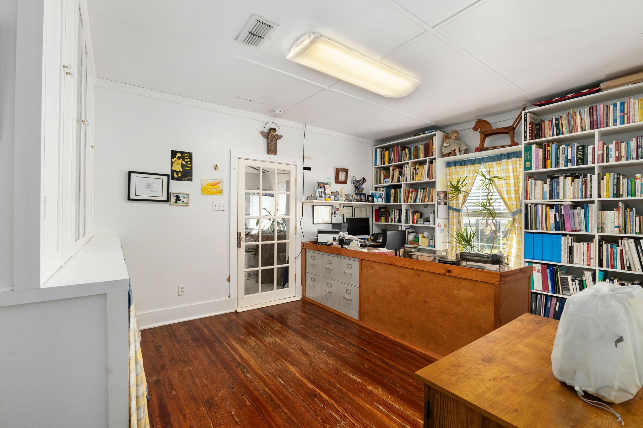 8103 Adamek Road Brenham, TX 77833 - Photo 15 of 42 a room with furniture and a book shelf