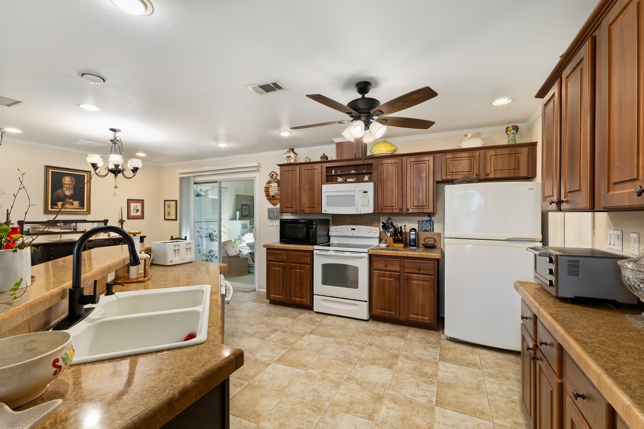 8103 Adamek Road Brenham, TX 77833 - Photo 22 of 42 a kitchen with kitchen island white cabinets and stainless steel appliances