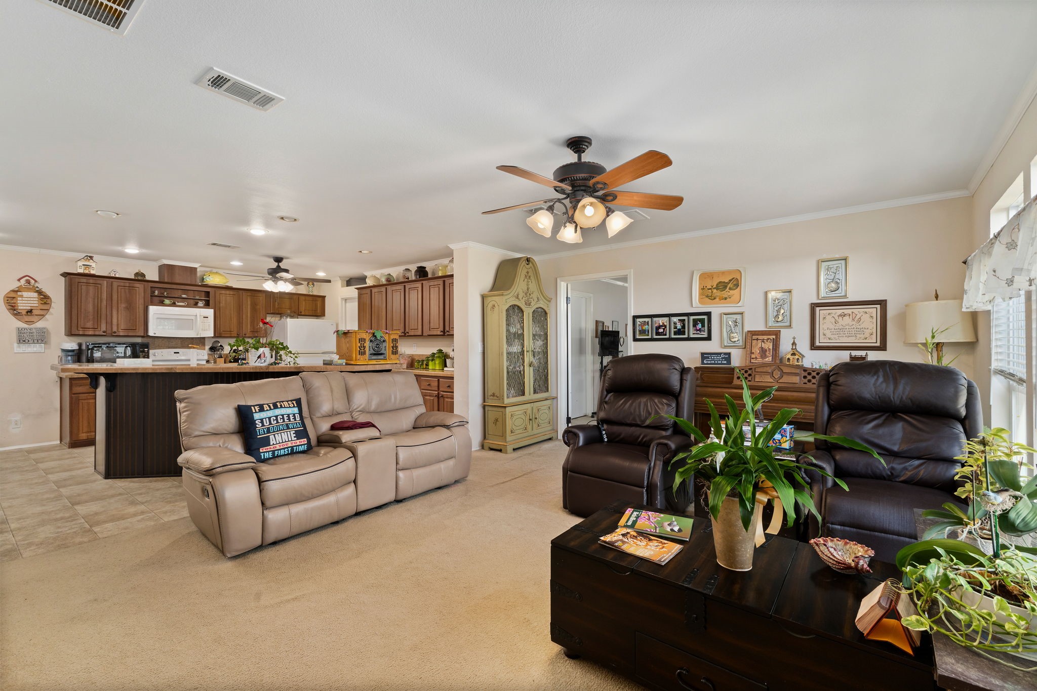 8103 Adamek Road Brenham, TX 77833 - Photo 23 of 42 a living room with furniture kitchen view and a chandelier