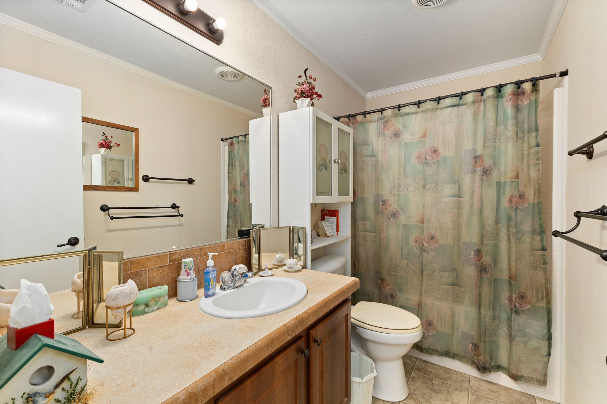 8103 Adamek Road Brenham, TX 77833 - Photo 28 of 42 a bathroom with a sink a toilet and shower