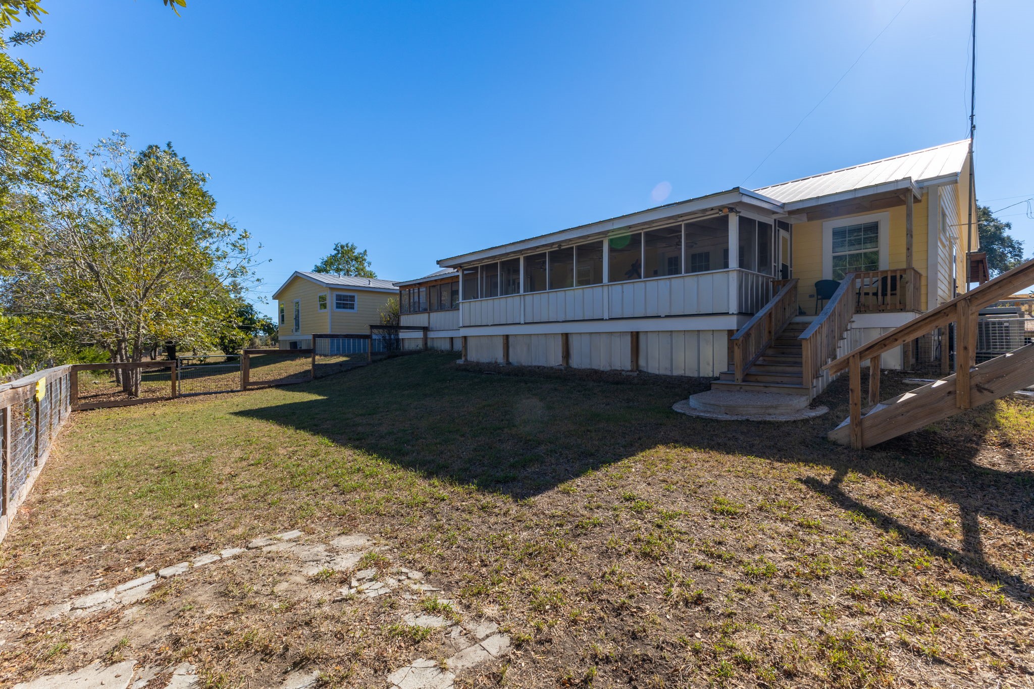 8103 Adamek Road Brenham, TX 77833 - Photo 32 of 42 a view of a house with a yard