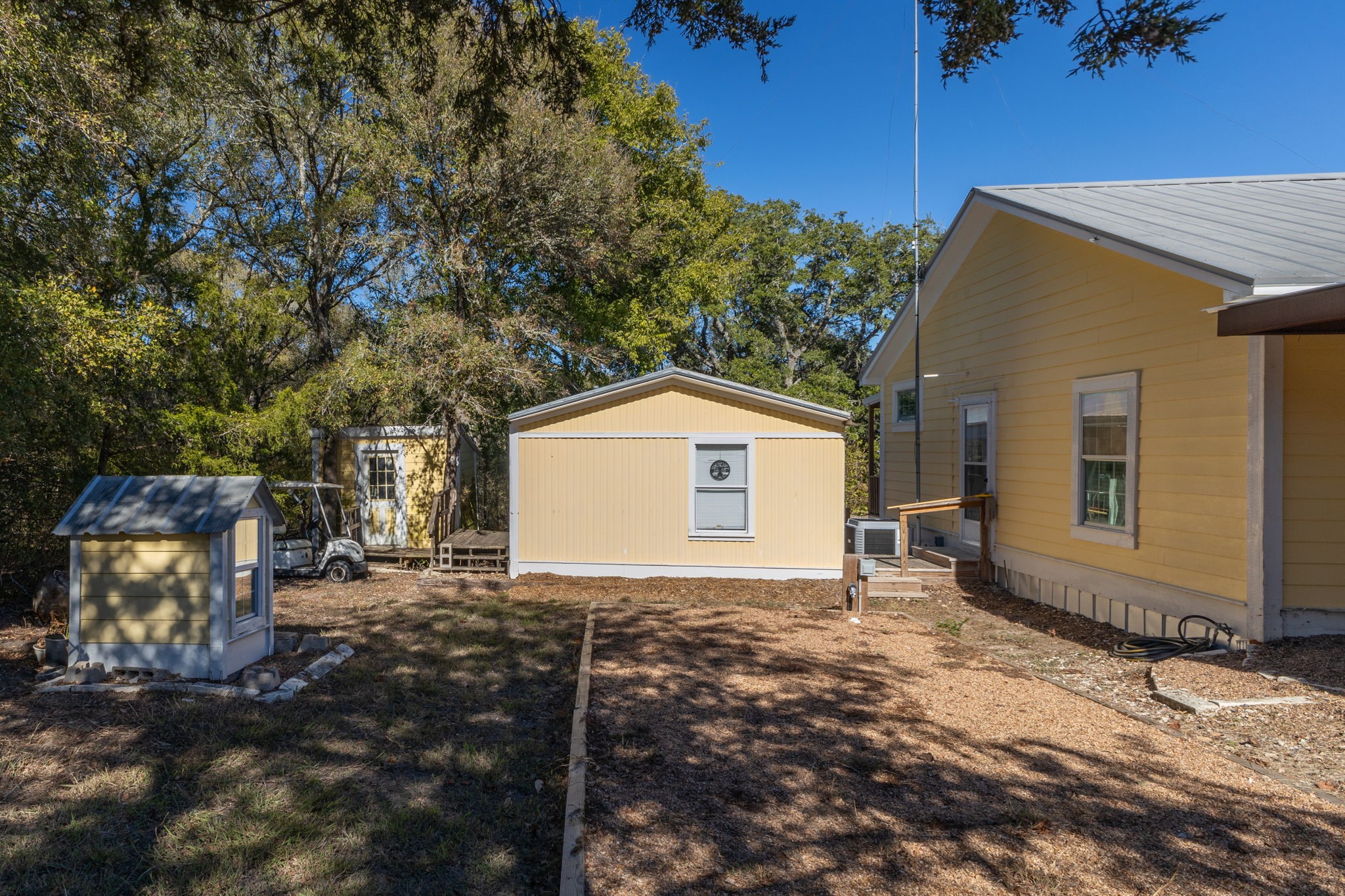 8103 Adamek Road Brenham, TX 77833 - Photo 35 of 42 a view of a house with a yard