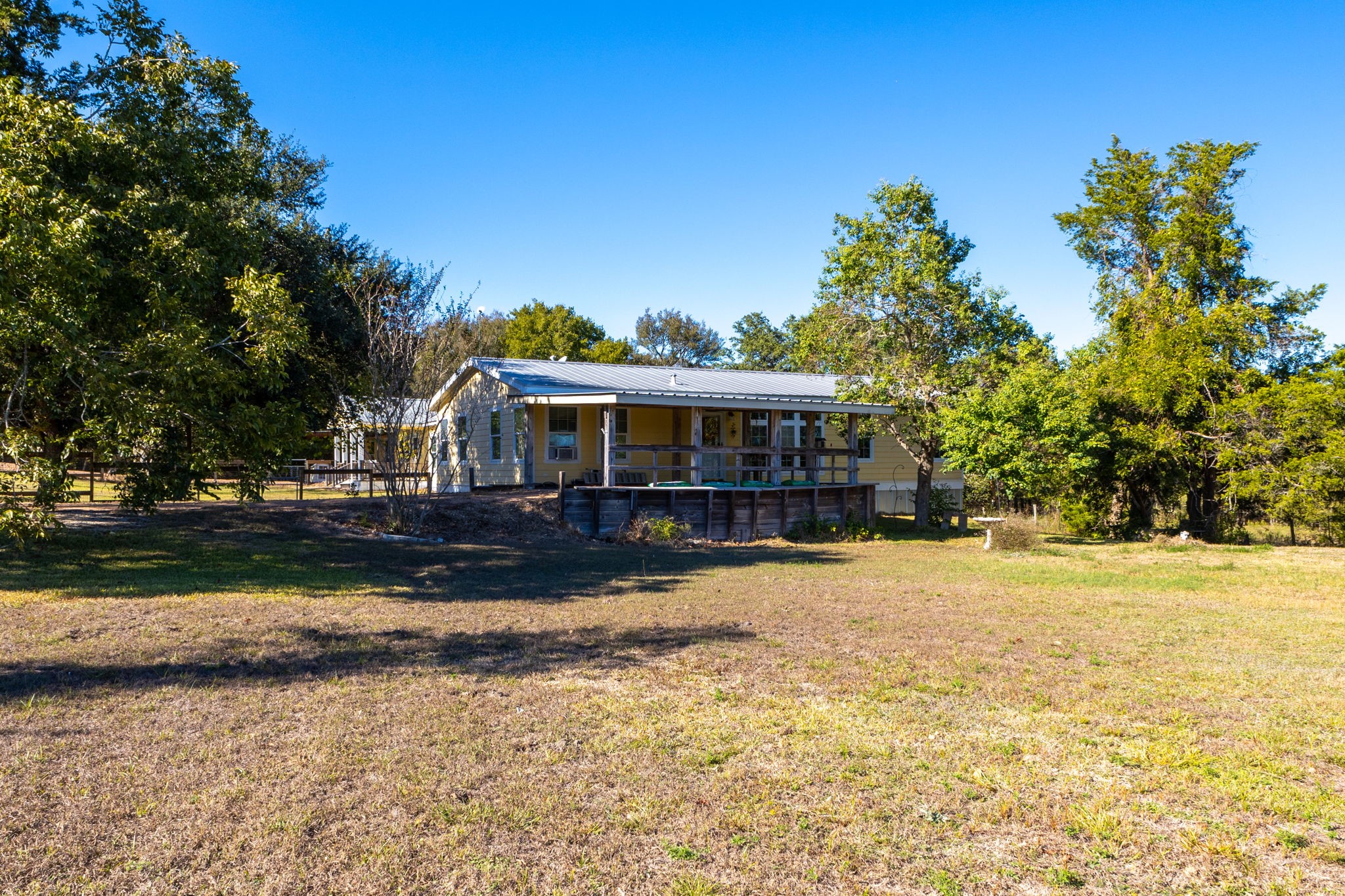 8103 Adamek Road Brenham, TX 77833 - Photo 37 of 42 a front view of a house with a yard